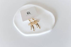 The Daisy gold plated bow hoop earrings